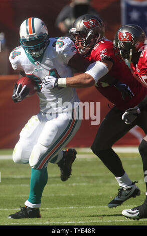 Miami Dolphins running back Ricky Williams, right, runs against San ...