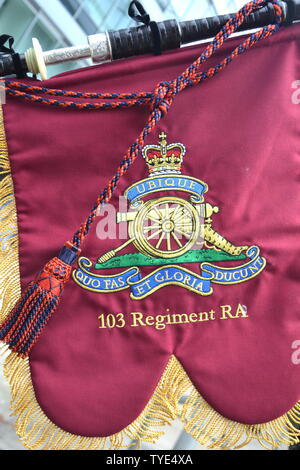 British Army Reserves Recruitment day at Piccadilly Station, Manchester, UK. A banner on the bagpipe of a musician in the 103 Regiment Royal Artillery. Stock Photo