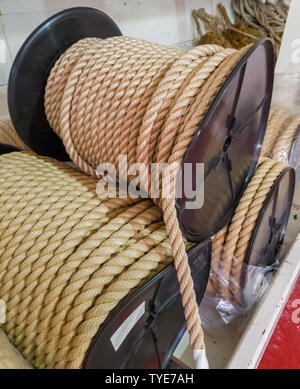 Large synthetic rope coils in the warehouse of the ship. Selective focus. Stock Photo