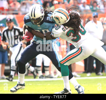 Miami Dolphins safety Chris Clemmons (30) celebrates a tackle during third  quarter action against the New England Patriots at Sun Life Stadium  December 2, 2012 in Miami, Florida. The New England Patriots