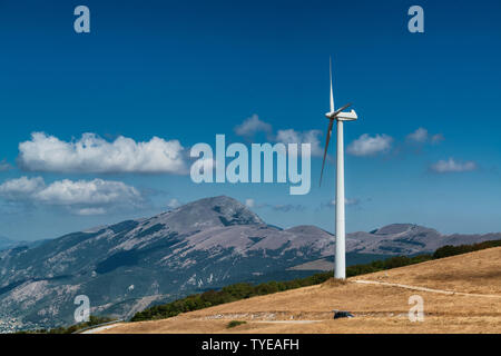 Wind turbine on the top of a mountain in Nothern Italy. Clean enviroment friendly energy. Stock Photo