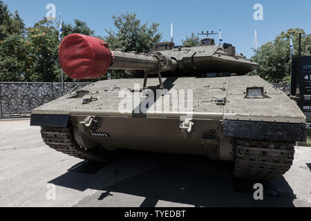 Jerusalem, Israel. 26th June, 2019. A Merkava Mark 4 tank stands on display. Operational in the IDF since 2004 it is equipped with the Trophy Advanced Active Protection System, weighs 60-80 tons and is capable of a speed of 64Kph. 'Our IDF' exhibition opens at the First Station in Jerusalem featuring armored combat vehicles, an F16 fighter jet, an audio video presentation and combat simulators based on virtual reality. The conscription based IDF, considered in Israel the 'people's army', opens its doors to the public free of charge fulfilling its role in creating a close bond with the public. Stock Photo