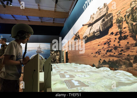 Jerusalem, Israel. 26th June, 2019. 'Our IDF' exhibition opens at the First Station in Jerusalem featuring armored combat vehicles, an F16 fighter jet, an audio video presentation and combat simulators based on virtual reality. The conscription based IDF, considered in Israel the 'people's army', opens its doors to the public free of charge fulfilling its role in creating a close bond with the public. Credit: Nir Alon/Alamy Live News. Stock Photo