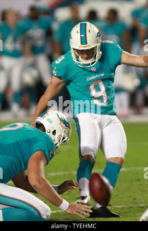 Miami Dolphins kicker Caleb Sturgis (9) kicks a field goal as punter ...