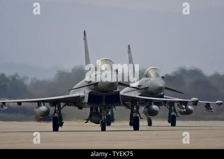 Two Royal Air Force Eurofighter Typhoon FGR4s taxi off of the runway after landing at Osan Air Base, Republic of Korea, Nov. 5, 2016. The arrival of the Typhoons marks the first time the RAF has fielded aircraft on the Korean Peninsula since 1956. Stock Photo