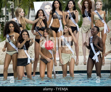 Miss Universe contestants  gather around the pool to model the Yamamay swimsuit collection during the swimsuit runway event at Trump National Doral pool in Miami, Florida on January 14, 2015. The 63rd. Miss Universe Pageant will be held in Miami, Florida, January 25, 2015. Photo by Gary I Rothstein/UPI Stock Photo