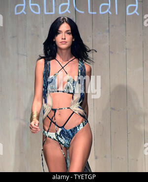 A runway model is seen presenting a swimsuit creation by Aguaclara      fashion designer during the Funkshion Miami Swim Week at the Funkshion tent, Miami Beach, Florida, July 15, 2016. Photo by Gary I Rothstein/UPI Stock Photo