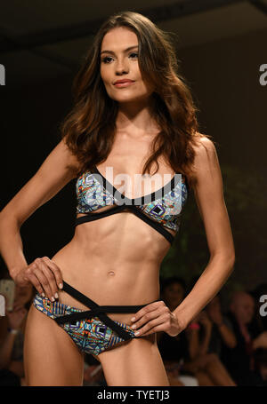 A runway model is seen presenting a swimsuit creation by Lume fashion designer during the Funkshion Miami Swim Week at the Funkshion tent, Miami Beach, Florida, July 15, 2016. Photo by Gary I Rothstein/UPI Stock Photo