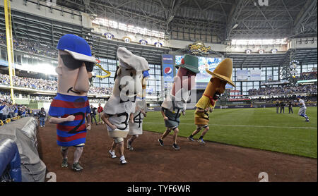 April 23, 2014 - Milwaukee, Wisconsin, United States of America - April 23,  2014: The sausage race during the Major League Baseball game between the  Milwaukee Brewers and the San Diego Padres