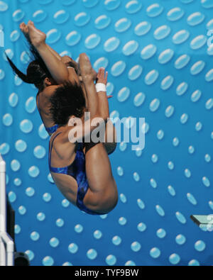 Chinese divers Jingjing Guo and Ting Li perform their final synchronized dives from the 3-meter springboard at the XI FINA World Championships in Montreal, Canada on July 24, 2005. Guo and Li won the gold medal with a total of 349.80 points  (UPI Photo / Grace Chiu) Stock Photo