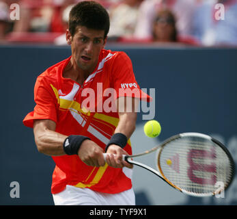 Novak Djokovic of Serbia returns serve to Roger Federer of Switzerland in the Rogers Cup ATP Masters Series at Uniprix Stadium in Montreal on August 12, 2007.  Djokovic defeated the top-ranked Federer 7-6(2), 2-6, 7-6(2) to lead the U.S. Open Series of tournaments. (UPI Photo/Grace Chiu). Stock Photo