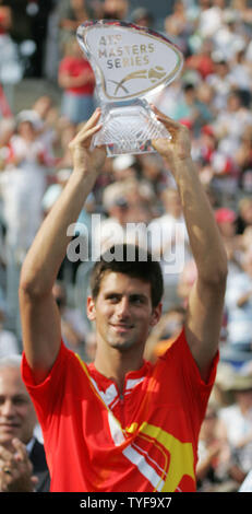 Novak Djokovic of Serbia hoists the ATP Masters Series trophy for winning the Rogers Cup  at Uniprix Stadium in Montreal on August 12, 2007.  Djokovic defeated the top-ranked Roger Federer of Switzerland 7-6(2), 2-6, 7-6(2) to lead the U.S. Open Series of tournaments. (UPI Photo/Grace Chiu). Stock Photo