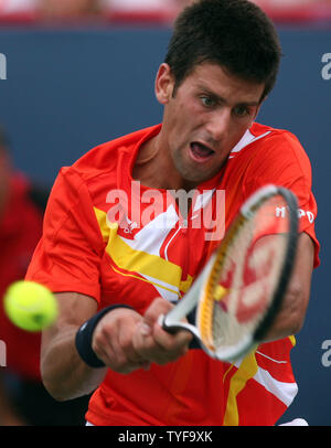 Novak Djokovic of Serbia backhands to Roger Federer of Switzerland in the finals of the Rogers Cup ATP Masters Series at Uniprix Stadium in Montreal on August 12, 2007.  Djokovic defeated the top-ranked Federer 7-6(2), 2-6, 7-6(2) to lead the U.S. Open Series of tournaments. (UPI Photo/Grace Chiu). Stock Photo