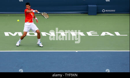 Novak Djokovic of Serbia backhands to Roger Federer of Switzerland in the finals of the Rogers Cup ATP Masters Series at Uniprix Stadium in Montreal on August 12, 2007.  Djokovic defeated the top-ranked Federer 7-6(2), 2-6, 7-6(2) to lead the U.S. Open Series of tournaments. (UPI Photo/Grace Chiu). Stock Photo