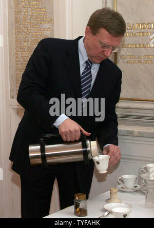 Russian Finance Minister Alexei Kudrin pours a cup of coffee during a State Council 's meeting, at the Kremlin in Moscow,  on December 27, 2005. (UPI Photo/Anatoli Zhdanov) Stock Photo