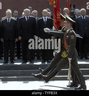 Russian President Vladimir Putin (R), Prime Minister Mikhail Fradkov (C) and Federation Council Chairman Sergey Mironov (L) stand in attention after a wreath laying ceremony at the Tomb of the Unknown Soldier at the wall of Kremlin in Moscow, on June 22, 2006. Today Russia marks the anniversary of Nazi Germany's 1941 attack on the Soviet Union. (UPI Photo/Anatoli Zhdanov) Stock Photo