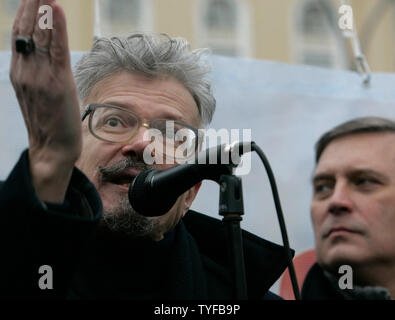 Former Russian prime minister and Kremlin critic Mikhail Kasyanov (R) looks on as leader of the radical National Bolshevik Party Eduard Limonov speaks during a rally in Moscow on December 16, 2006. Russian opposition parties rallied on Saturday to protest recent electoral law changes and to challenge President Vladimir Putin, but their demonstration in central Moscow was dwarfed by riot police. (UPI Photo/Anatoli Zhdanov) Stock Photo