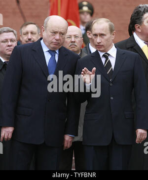 Russian President Vladimir Putin (R) talks to Prime Minister Mikhail Fradkov during a wreath laying ceremony at the Tomb of the Unknown Soldier at the Kremlin wall in Moscow on May 8, 2007. Russia officially celebrates its victory over Nazi Germany on May 9. (UPI Photo/Anatoli Zhdanov) Stock Photo