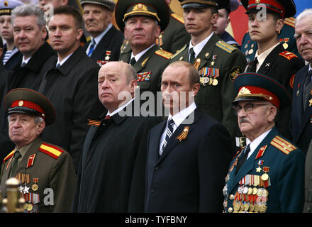 Russian President Vladimir Putin (2nd R) and Prime Minister Mikhail Fradkov attend a military parade on the Red Square in Moscow on May 9, 2007. Russia is celebrating the 62nd anniversary of the World War Two victory over Nazi Germany. (UPI Photo/Anatoli Zhdanov) Stock Photo