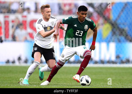 Marco Reus (L) of Germany challenges Jesus Gallardo of Mexico during the 2018 FIFA World Cup Group F match at the Luzhniki Stadium in Moscow, Russia on June 17, 2018. Photo by Chris Brunskill/UPI Stock Photo