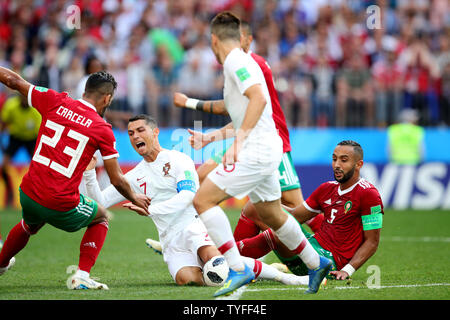 Cristiano Ronaldo (R) of Portugal is fouled by Mehdi Benatia of Morocco during the 2018 FIFA World Cup Group B match at the Luzhniki Stadium in Moscow, Russia on June 20, 2018. Photo by Chris Brunskill/UPI Stock Photo