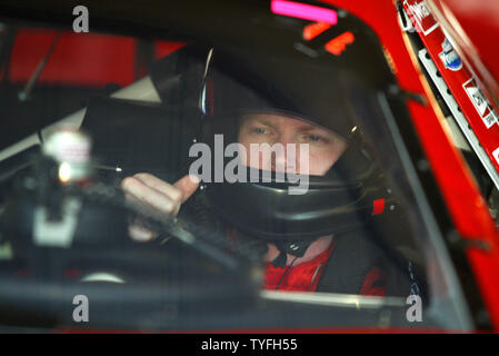 Dale Earnhardt Jr. sits in his Budweiser Chevrolet awaiting the start of practice for the Subway 500 NASCAR race at Martinsville Speedway in Martinsville, Virginia on October 20, 2006. Earnhardt is currently in fifth place in the Nextel Cup Chase. (UPI Photo/Nell Redmond) Stock Photo