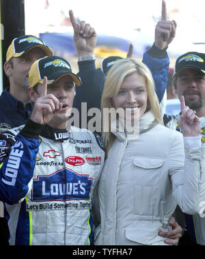 Jimmie Johnson and his wife Chandra celebrate Johnson's victory in the Subway 500 race at Martinsville Speedway in Martinsville, Virginia on October 22, 2006. (UPI Photo/Nell Redmond) Stock Photo