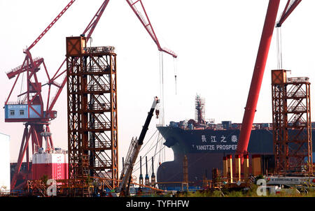 Ships are built at Guangzhou Longxue Ship Building Conglomeration's massive dockyard in Nansha, a major city in Southern China's Guangdong Province on October 24, 2013.  Longxue aims to become one of the world's premier shipbuilders as China increases its push to become a leader in global shipbuilding.    UPI/Stephen Shaver Stock Photo