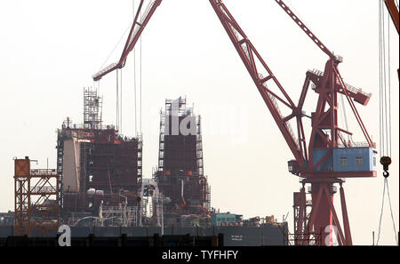 Ships are built at Guangzhou Longxue Ship Building Conglomeration's massive dockyard in Nansha, a major city in Southern China's Guangdong Province on October 24, 2013.  Longxue aims to become one of the world's premier shipbuilders as China increases its push to become a leader in global shipbuilding.    UPI/Stephen Shaver Stock Photo