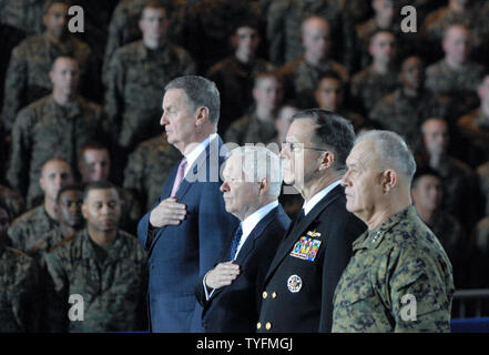(L to R) National Security Advisor General James Jones, Defense Secretary Robert Gates, Chairman of the Joint Chiefs of Staff Admiral Michael Mullen, and General Dennis Hejlik listen to the National Anthem, prior to the arrival of U.S. President Barack Obama at Camp Lejeune in North Carolina on February 27, 2009. President Obama thanked Marines and their families for their service as he outlined plans for the war in Iraq. (UPI Photo/Alexis C. Glenn) Stock Photo