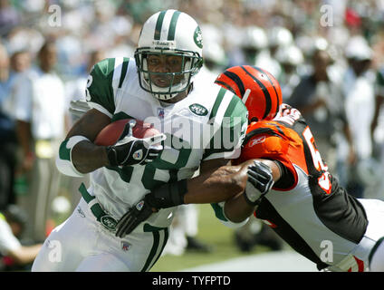 New York Jets runningback Curtis Martin breaks free of Cincinnati Bengals  Kim Herring and scores a touchdown at Giants Stadium in East Rutherford, New  Jersey on September 12, 2004. (UPI Photo/John Angelillo