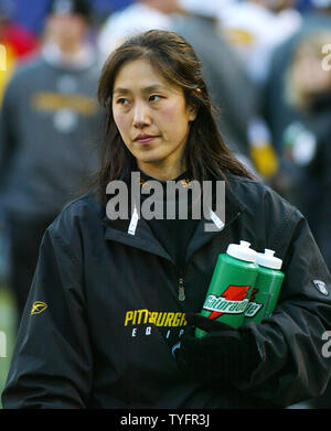 Pittsburgh Steelers trainer Ariko Iso watches a game replay on the