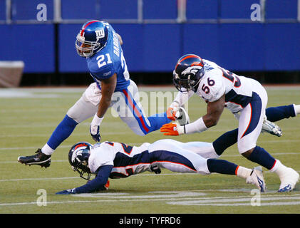 New York Giants Tiki Barber exchanges words with brother Ronde Barber after  the game at Giants Stadium in East Rutherford, New Jersey on October 29,  2006. The New York Giants defeated the