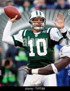 New York Jets head Chad Pennington throws a pass over a leaping Miami  Dolphins Jason Taylor in the first quarter at Giants Stadium in East  Rutherford, New Jersey on October 15, 2006.