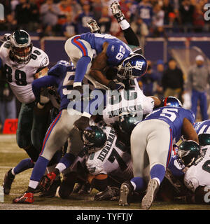 Philadelphia Eagles Brian Westbrook jumps over the pile and into