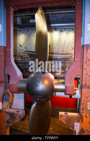 The rudder, lifting frame and screw propeller of the SS Great Britain inside The Dockyard Museum at Brunel's steam ship in Bristol. UK. Raising the propeller was an 1857 modification for efficiency in the water when sailing under the power of wind. The lifting frame was removed to take the ship back to its original state. (109) Stock Photo
