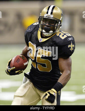 Atlanta Falcons linebacker Keith Brooking manages to tackle New Orleans  Saints running back Reggie Bush during first quarter action. The Saints  defeated the Falcons 22-16 at the Louisiana Superdome in New Orleans