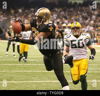 16 November 2008: Saints receiver Lance Moore tries for extra yards with a  Chiefs defender hanging on after making a reception makes a reception. Moore  had 8 receptions for 102 yards and