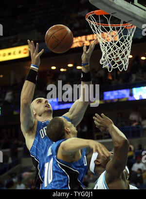 Orlando Magic center Marcin Gortat (13) pulls in a rebound during NBA action against the New Orleans Hornets in New Orleans February 18, 2009. New Orleans won 117-85.  (UPI Photo/A.J. Sisco) Stock Photo