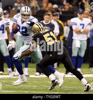 Dallas Cowboys Jason Witten (82) runs away from New Orleans Saints Jonathan Vilma (51) during action at the Louisiana Superdome in New Orleans on December 19, 2009.  UPI/A.J. Sisco Stock Photo