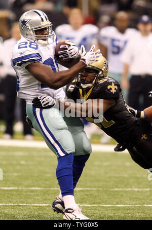 Dallas Cowboys running back Felix Jones (28) is stopped by New Orleans defender Jonathan Vilma (51) during second half action at the Louisiana Superdome in New Orleans on December 19, 2009.   UPI/A.J. Sisco Stock Photo