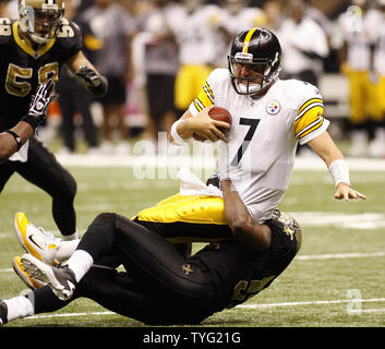 New Orleans Saints quarterback Drew Brees (black shirt) celebrates on the  field with Jonathan Vilma after the Saints beat the Vikings 31-28 to win  the NFC Championship game at the Louisiana Superdome