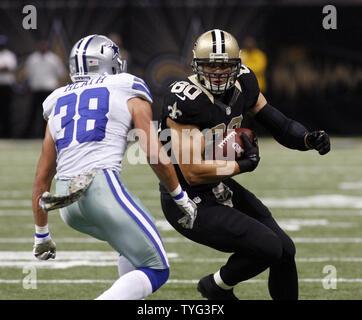 New Orleans Saints tight end Jimmy Graham (80) takes a Drew Brees pass 7 yards during the second quarter against the Dallas Cowboys at the Mercedes-Benz Superdome in New Orleans, Louisiana on November 10, 2013. Defending on the play is Cowboys strong safety Jeff Heath (38)  UPI/A.J. Sisco Stock Photo