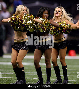 The New Orleans Saints dance team the Saintsations entertain the crowd during a break in the action of a preseason game featuring New Orleans Saints and the Baltimore Ravens at the Mercedes-Benz Superdome in New Orleans August 28, 2014. UPI/A.J. Sisco Stock Photo