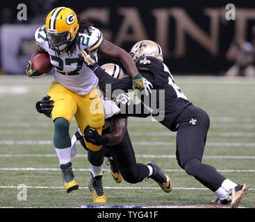 Baltimore Ravens running back Justin Forsett (29) gives New Orleans Saints  middle linebacker Curtis Lofton (50) a stiff arm on his way to gaining 11  yards during the second quarter at the