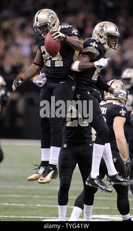 New Orleans Saints cornerback Corey White (24) celebrates his interception of Green Bay Packers quarterback Aaron Rodgers  with teammate cornerback Keenan Lewis (28) during the fourth quarter at the Mercedes-Benz Superdome in New Orleans October 26, 2014. UPI/A.J. Sisco Stock Photo