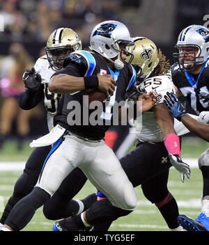 Buffalo Bills running back Duke Johnson (22) attempts to avoid the tackle  by Carolina Panthers cornerback Kalon Barnes (35) during an NFL preseason  football game on Friday, Aug. 26, 2022, in Charlotte