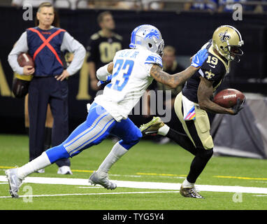 New Orleans Saints wide receiver Ted Ginn (19) takes a Drew Brees pass 25 yards in the first quarter against the Detroit Lions at the Mercedes-Benz Superdome in New Orleans October 15, 2017. Defending on the play is Detroit Lions cornerback Darius Slay (23).  Photo by AJ Sisco/UPI Stock Photo