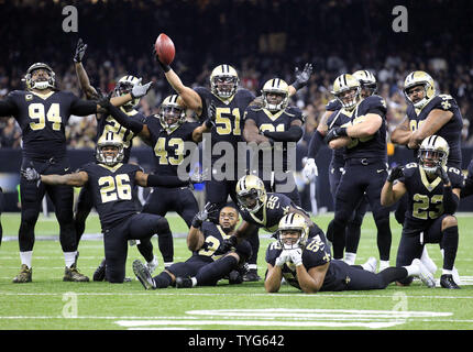 The New Orleans Saints defense celebrates a P.J. Williams (26) interception  return of 45-yards for a touchdown in the third quarter against the  Minnesota Vikings on Sunday, Oct. 28, 2018 at U.S.