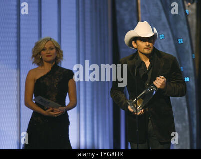 Brad Paisley accepts the Male Vocalist of the Year award, as presenter Reece Witherspoon looks on, at the 42nd annual Country Music Association (CMA) awards in Nashville, Tennessee on November 12, 2008. (UPI Photo/John Sommers II) Stock Photo